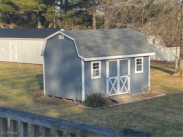 view of outdoor structure featuring a lawn