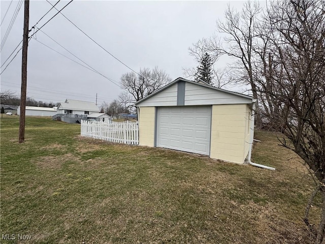 garage with a lawn