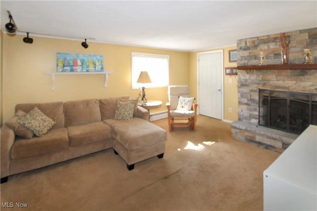 living room featuring a stone fireplace and carpet flooring