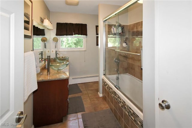 bathroom with enclosed tub / shower combo, a baseboard radiator, vanity, and tile patterned floors