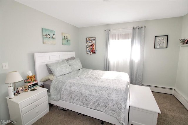 carpeted bedroom featuring a baseboard heating unit