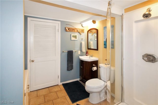 bathroom featuring ornamental molding, vanity, toilet, and tile patterned flooring