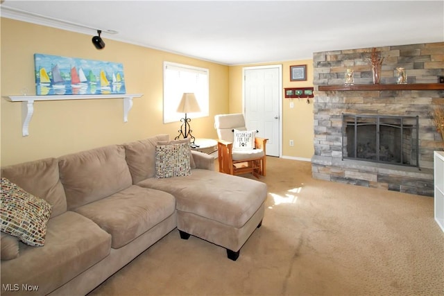 living room featuring a stone fireplace and carpet floors