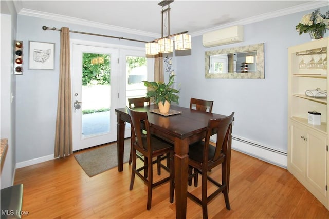 dining area with a baseboard heating unit, crown molding, an AC wall unit, and light wood-type flooring