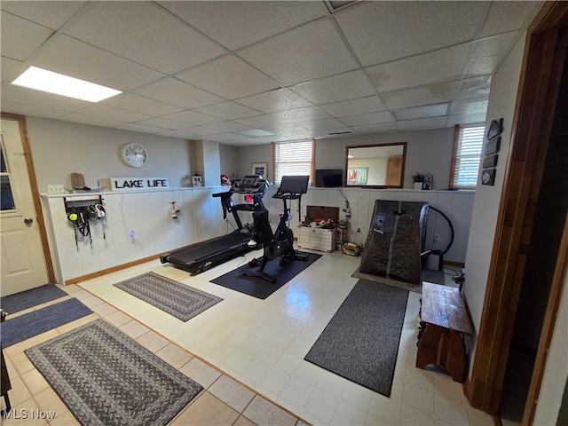 workout room with a drop ceiling