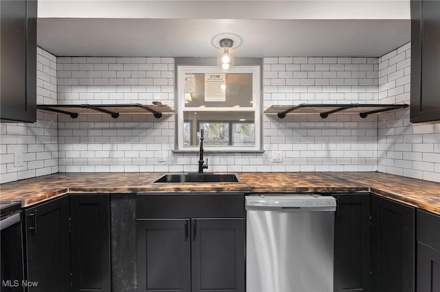 kitchen with sink, stainless steel dishwasher, and decorative backsplash