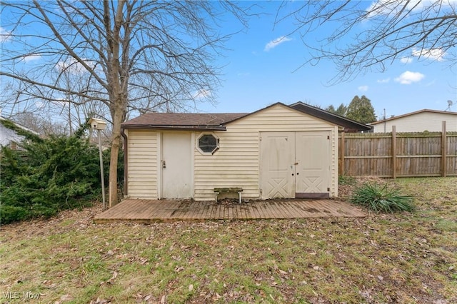 view of outbuilding with a yard