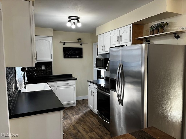 kitchen with sink, appliances with stainless steel finishes, dark hardwood / wood-style floors, white cabinets, and backsplash