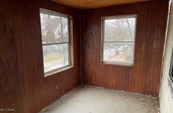 empty room with wood walls