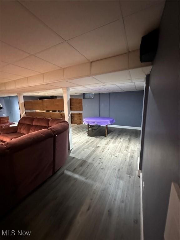 interior space featuring hardwood / wood-style floors and a paneled ceiling