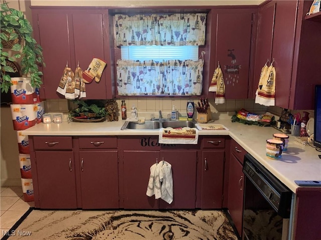 kitchen with black dishwasher, sink, decorative backsplash, and light tile patterned floors