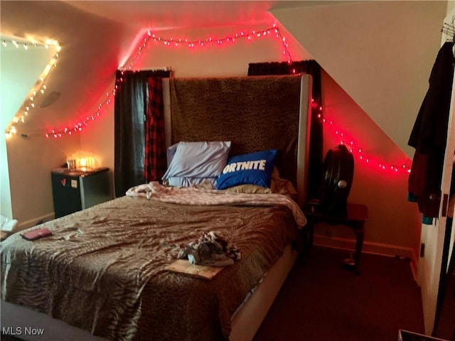 bedroom featuring track lighting