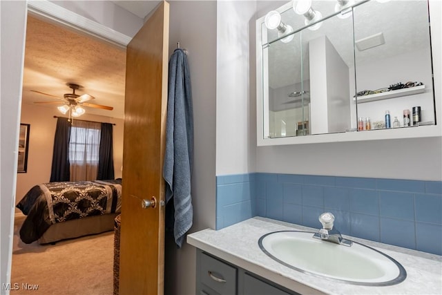 bathroom featuring vanity and ceiling fan