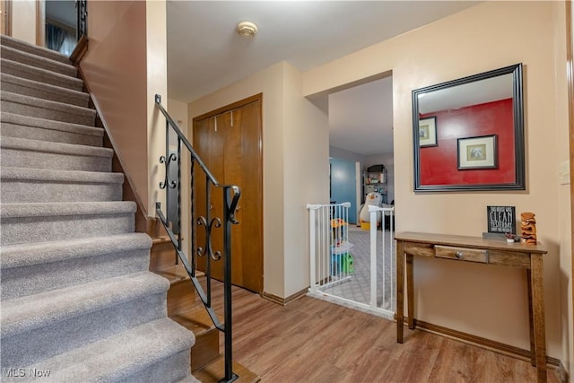 staircase featuring hardwood / wood-style flooring