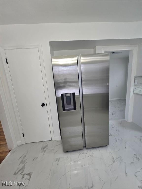 kitchen featuring stainless steel fridge