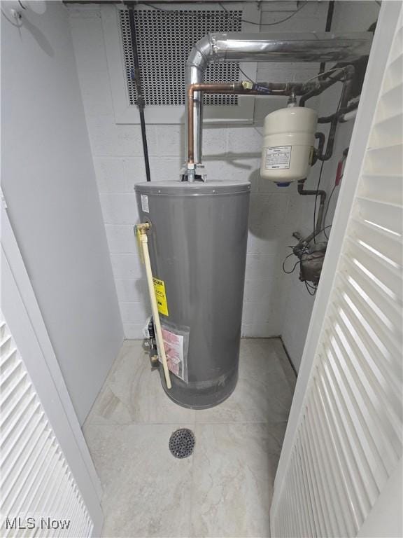 utility room with water heater