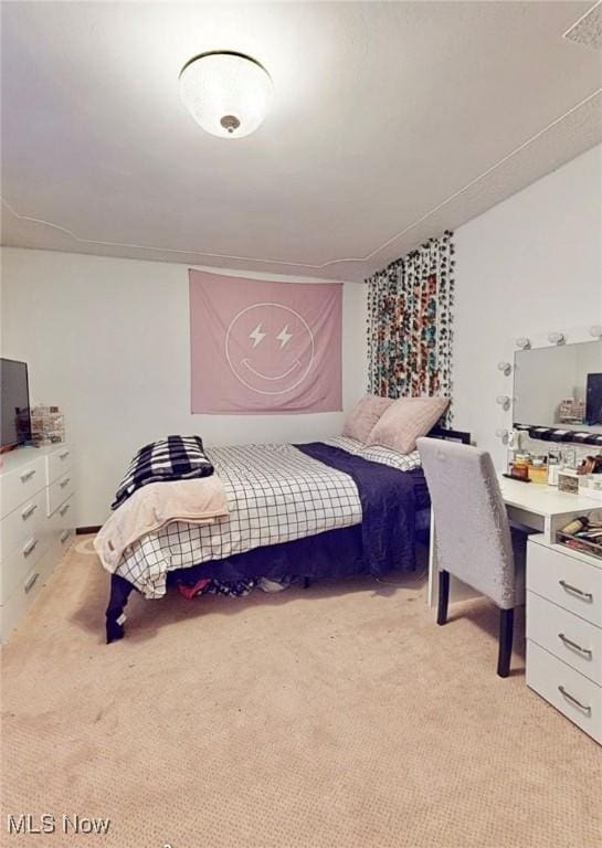 bedroom featuring light colored carpet