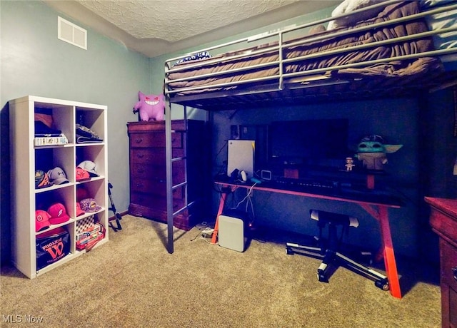 carpeted bedroom featuring a textured ceiling