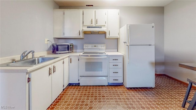 kitchen with white cabinetry, sink, and white appliances