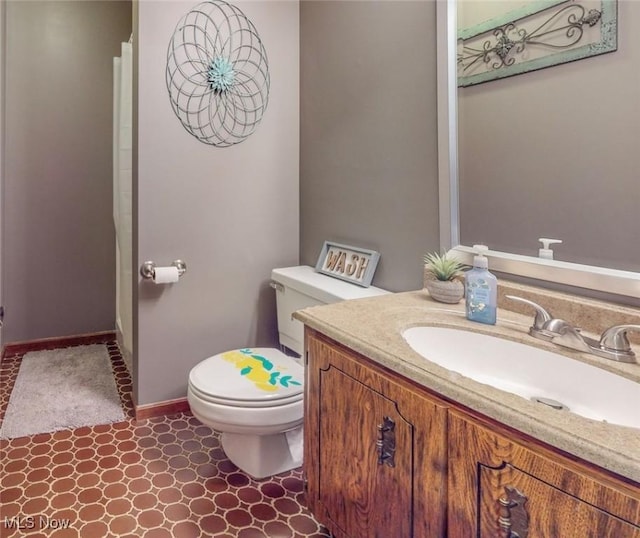 bathroom featuring vanity and toilet