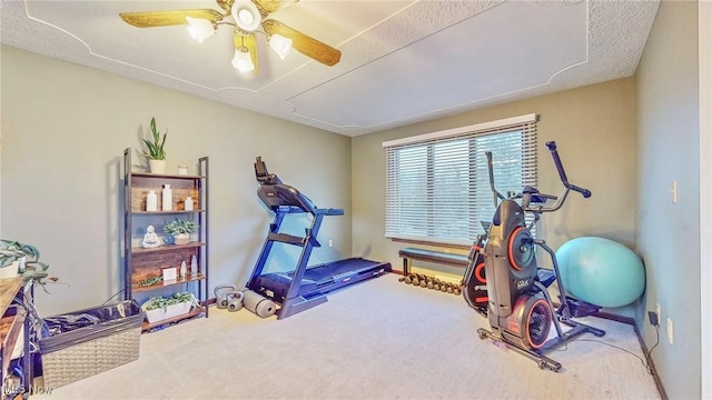 workout room with carpet and ceiling fan