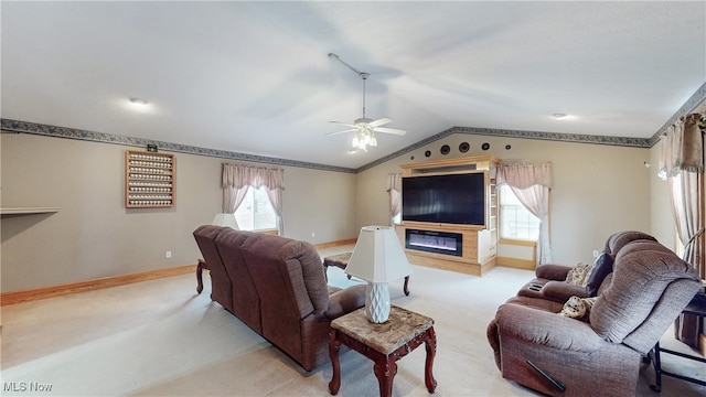 living room featuring lofted ceiling, light colored carpet, and ceiling fan