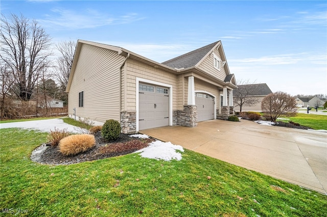 view of home's exterior with a garage and a lawn