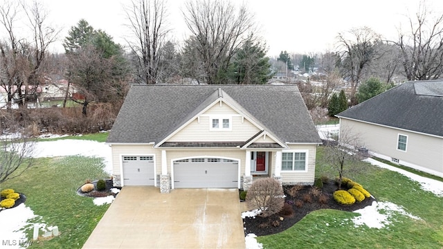 view of front of house with a garage and a front yard