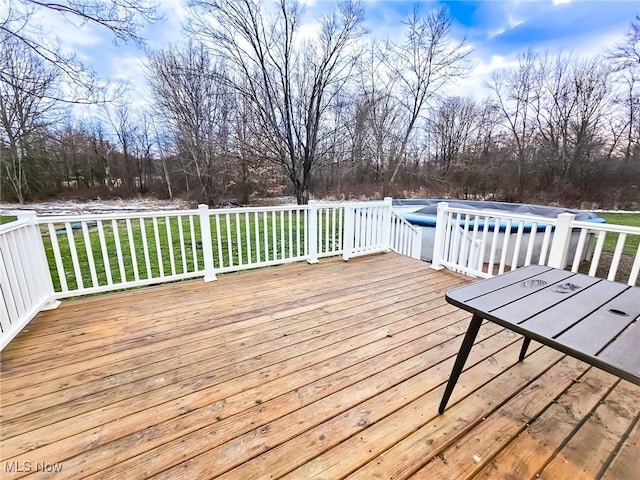 deck featuring a lawn