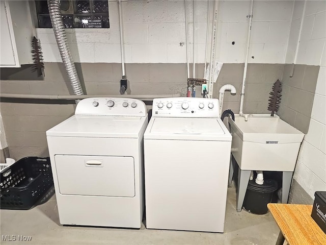 laundry area featuring washing machine and clothes dryer