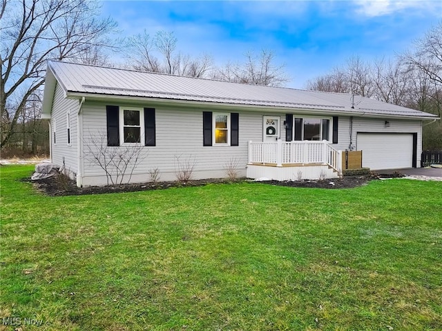 ranch-style house with a garage, a front lawn, and covered porch