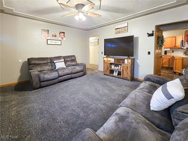 living room with dark colored carpet and ceiling fan