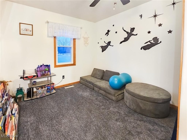 interior space featuring ceiling fan and carpet