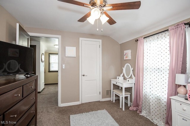 bedroom with vaulted ceiling, ceiling fan, and dark colored carpet