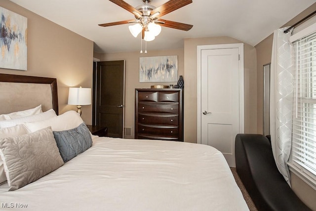 bedroom with ceiling fan and lofted ceiling