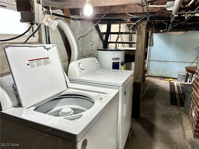 laundry area featuring water heater and washer and dryer