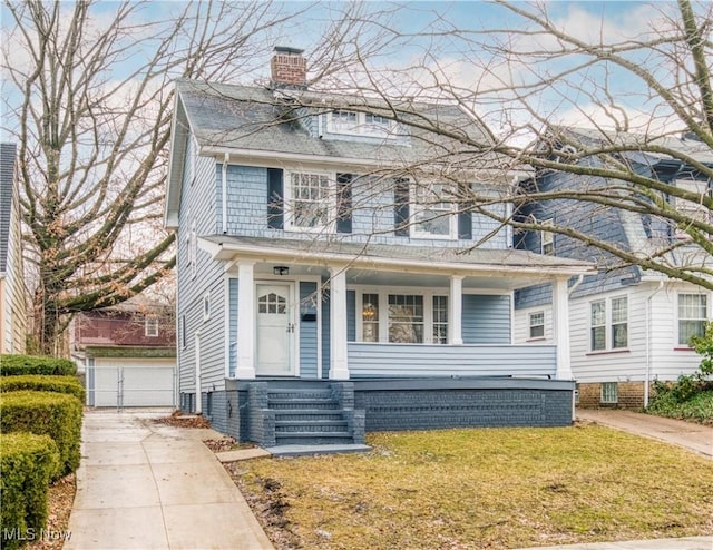 view of front facade with covered porch and a front lawn