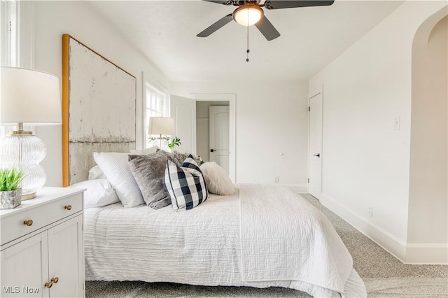 carpeted bedroom featuring ceiling fan