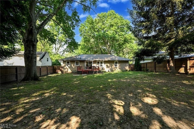 view of yard with a wooden deck