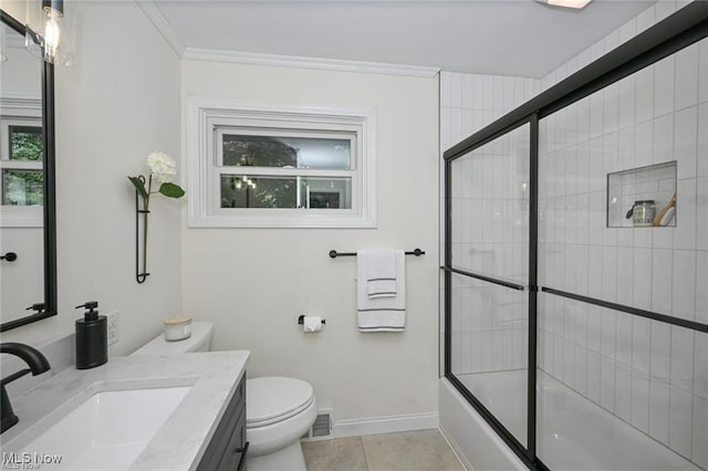 full bathroom featuring toilet, combined bath / shower with glass door, crown molding, vanity, and tile patterned flooring