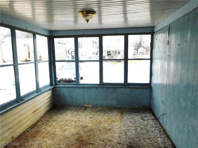 unfurnished sunroom featuring plenty of natural light