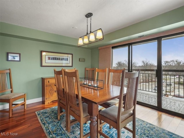 dining area featuring dark hardwood / wood-style flooring