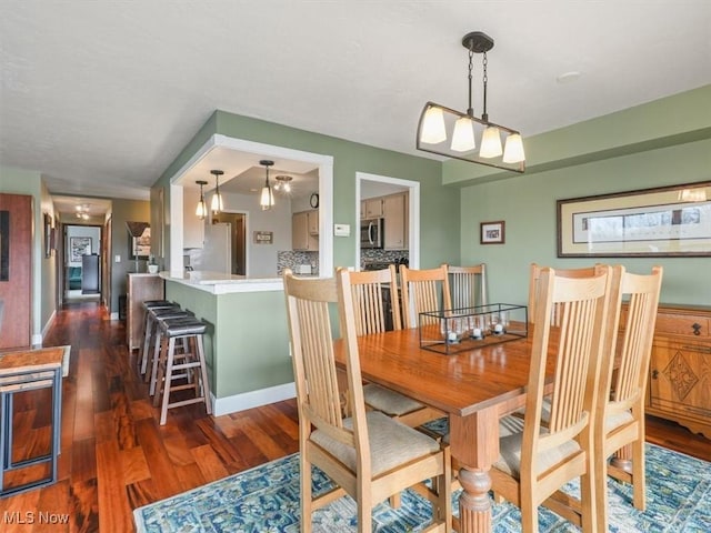 dining room featuring dark wood-type flooring