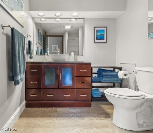 bathroom featuring vanity, an enclosed shower, hardwood / wood-style flooring, and toilet