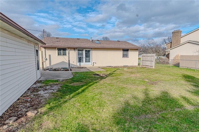 back of house featuring a yard and a patio