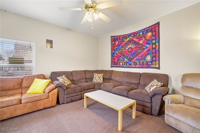 living room featuring vaulted ceiling, ceiling fan, and carpet