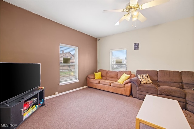 living room featuring carpet, a wealth of natural light, and ceiling fan