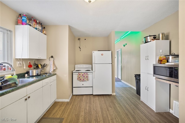 kitchen featuring white cabinetry, white appliances, sink, and light wood-type flooring