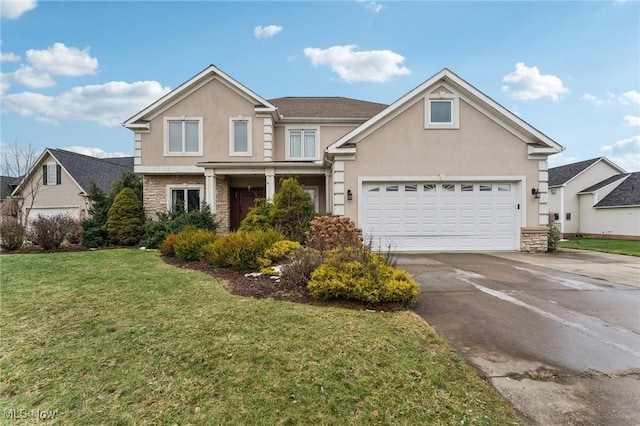 view of front of home featuring a garage and a front lawn