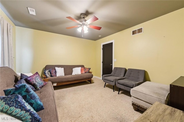 living room featuring ceiling fan and carpet flooring